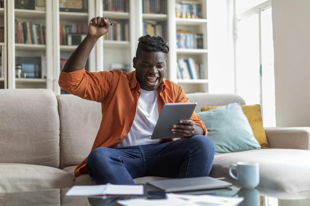 African american plump guy student passing test online